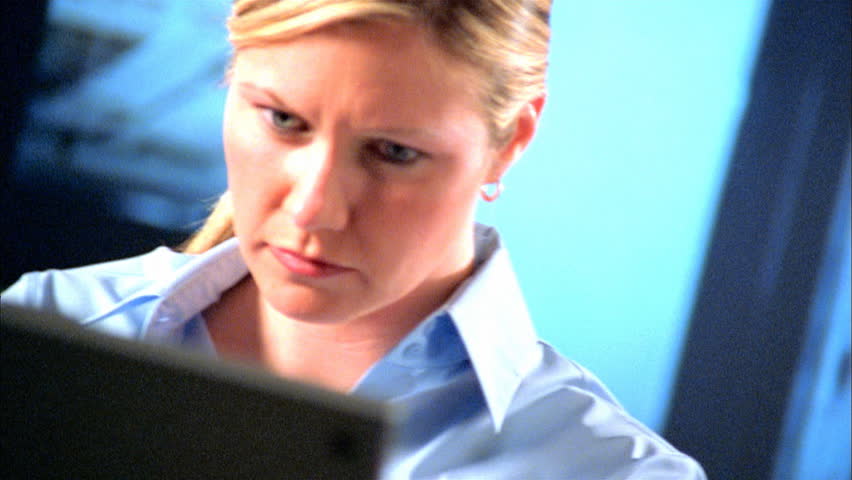 Quizzical business woman at computer