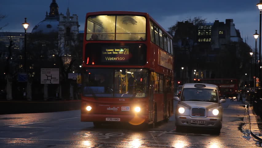 LONDON, UK - APRIL 2: Bus and cab with police car going by on April 2, 2012 in London, UK.