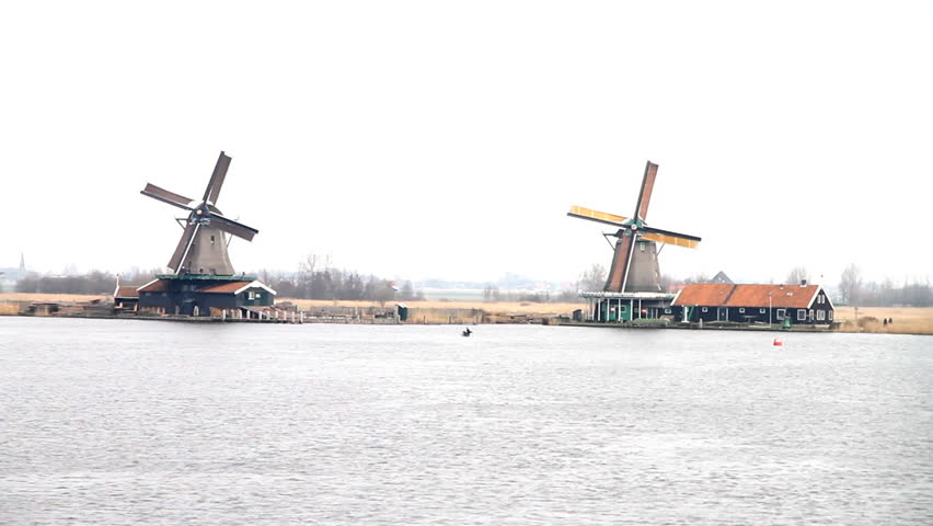 old vintage Windmills at zaanse schans on a cloudy day