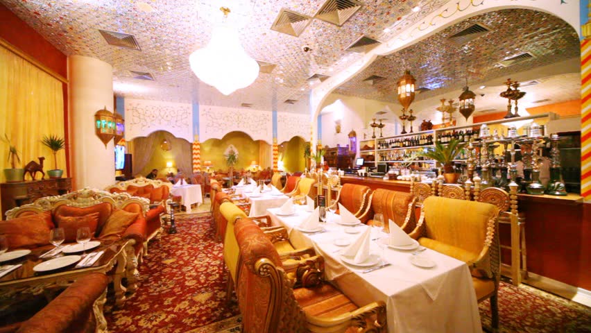 Lounge of restaurant is filled with magnificent sofas in east style