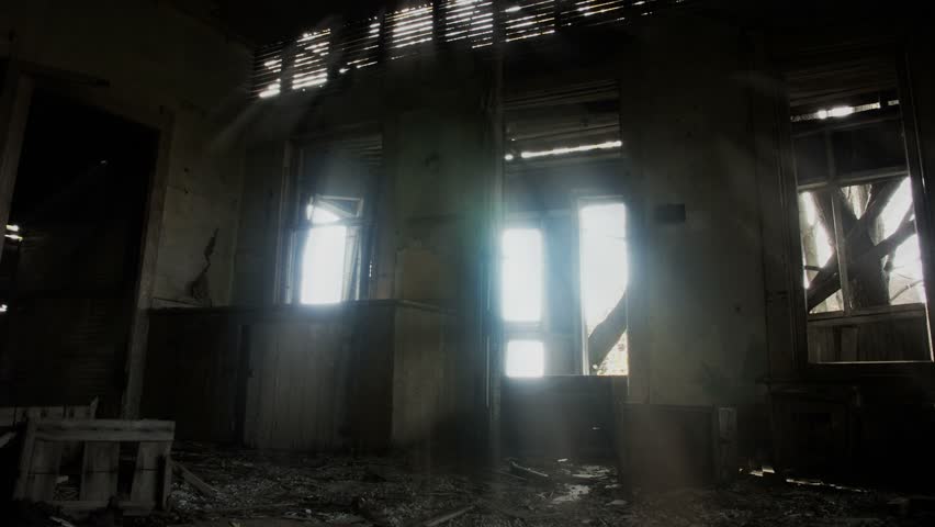 Timelapse of haunted house interior with sunbeam.