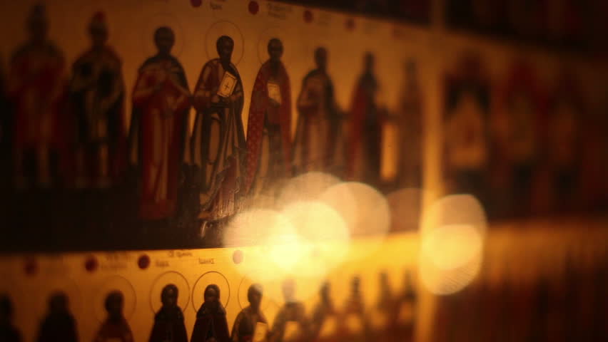 MOSCOW - JANUARY 14: Icons of saints and candles inside the church at the Savvinskiy Monastery on January 14, 2012 in Moscow, Russia.
