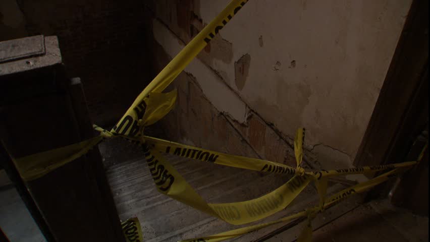 Caution tape over staircase