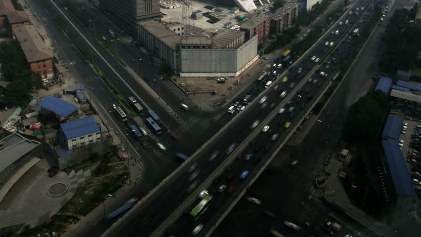 Timelapse tilt up aerial view of CCTV tower construction in Beijing, China.