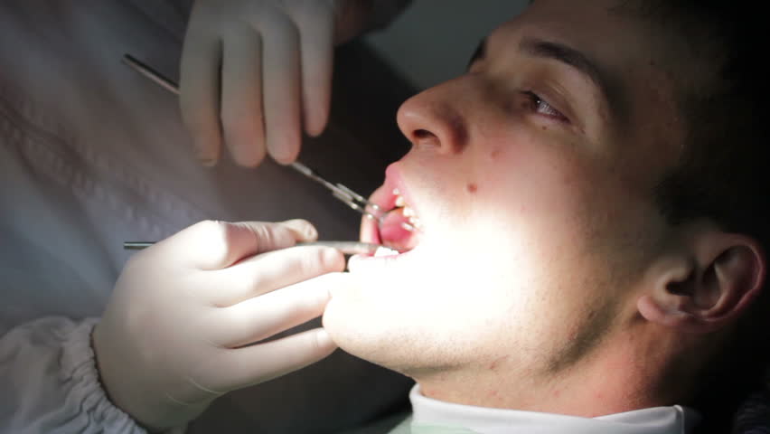 Patient open mouth during oral checkup