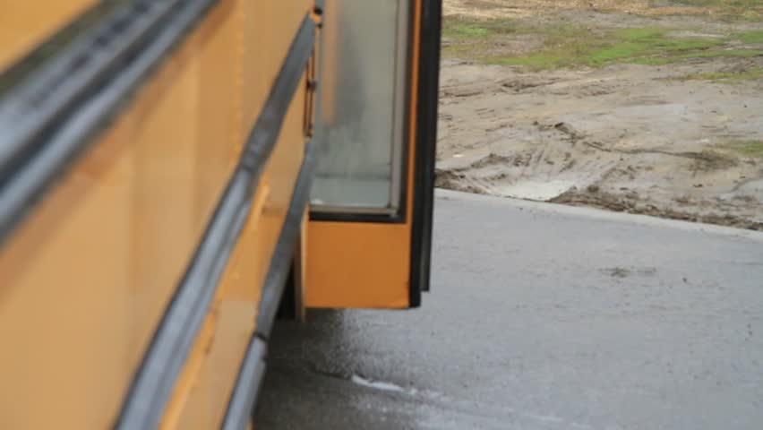 Kids getting off of school bus