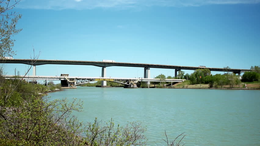 Traffic over the Homer Lift Bridge which spans the Welland Canal, Part of Garden City Skyway is seen in top background.