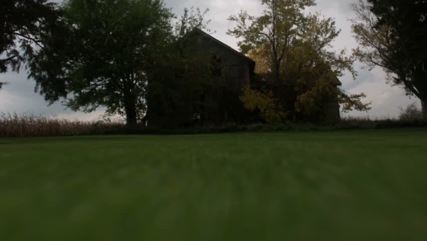 Timelapse crane up of haunted house.