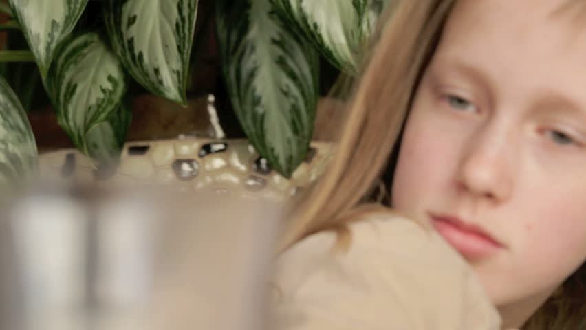 Young girl drinking lemonade