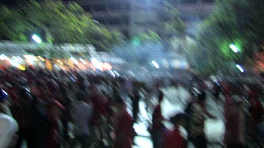 BANGKOK - MARCH 7: Red Shirt protestors battle government troops in a long night of violence at Democracy Monument on March 7, 2010 in Bangkok, Thailand.