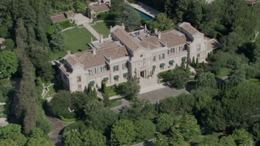 aerial shot of an English country-style manor and the surrounding property