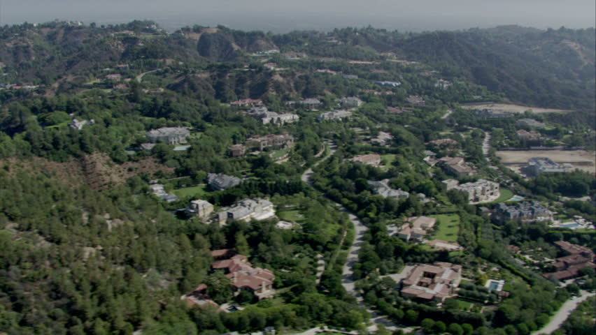 aerial view of upscale suburb featuring the curvature of the roads and lush landscaping circa 2009