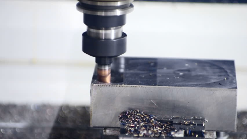 CNC machine milling some steel part