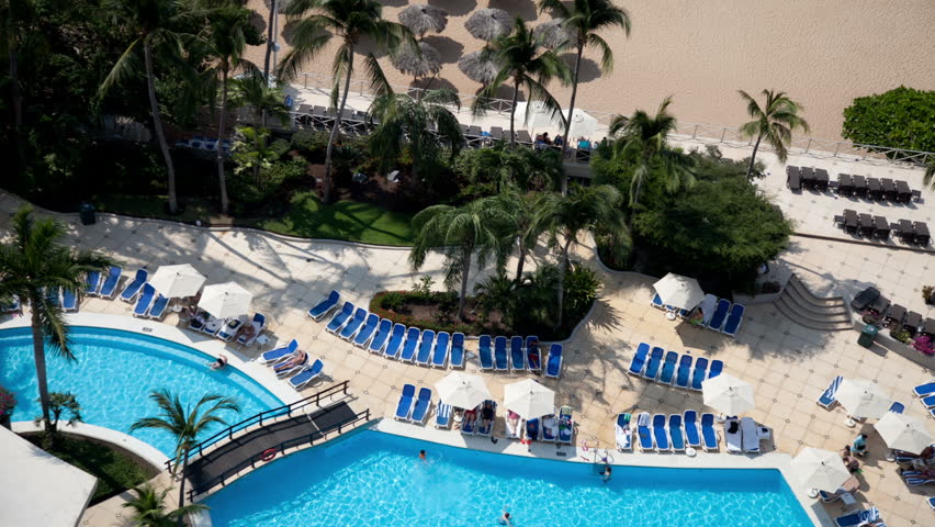 time-lapse of swimming pool in a luxury hotel, shot from a high floor balcony in acapulco, mexico