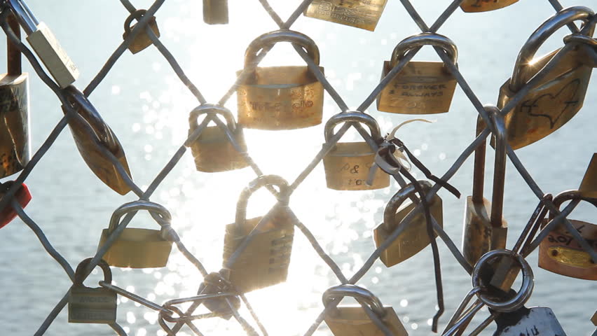 PARIS, FRANCE APRIL 8th: Padlocks on Pont des Arts, Paris on April 8th, 2012. The bridge is a favourite spot for couples who attach a padlock to the railing and throw the key into the river.