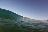 A tubing wave breaking near the beach on the north shore of Oahu in Hawaii.