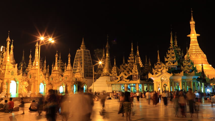 YANGON, MYANMAR- APRIL 15 : People visit the Shwedagon Pagoda on April 15, 2012.  Shwedagon Pagoda is the most sacred Buddhist pagoda for the Burmese. 