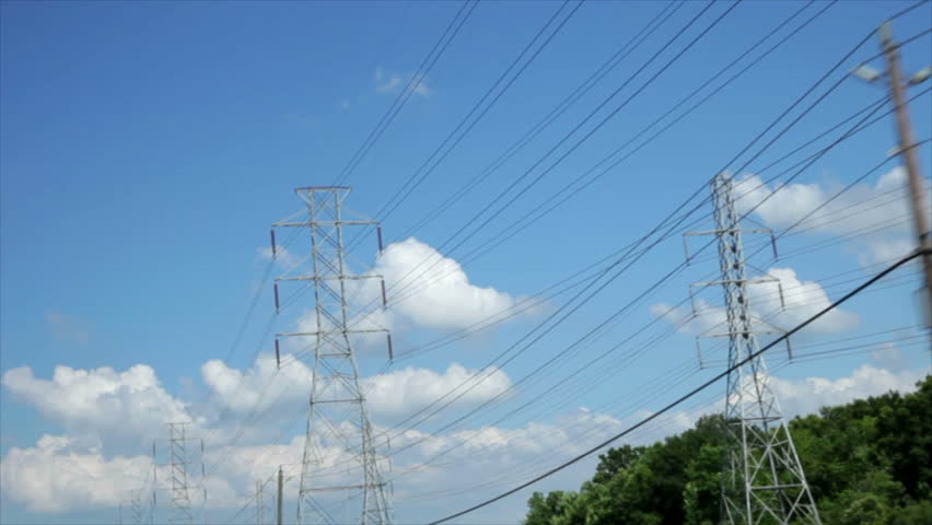 Miles of overhead power lines create a grid of electrical transmission through high-voltage wires.