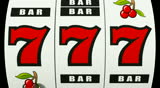 Slot machine hitting a lucky 7 jackpot
