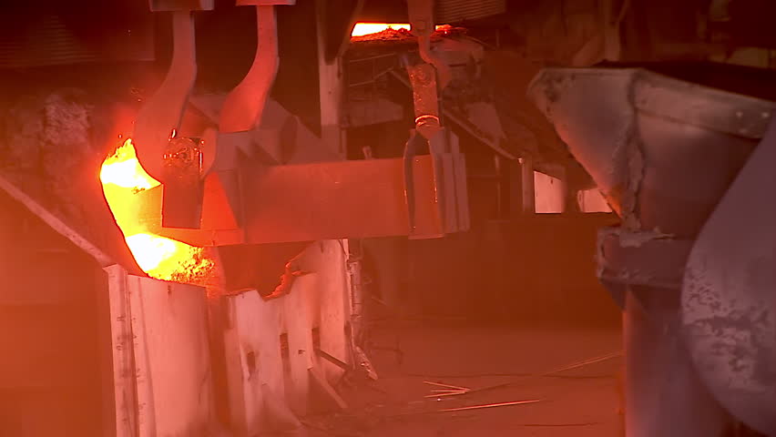 Iron and Steel Works. Converter plant. Loading scrap metal into a melting furnace.