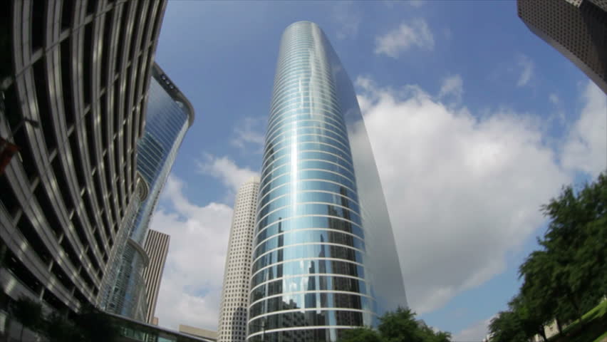The fisheye lens distorts the circular skywalk of a metropolitan Houston making it bend a curve back upon itself.