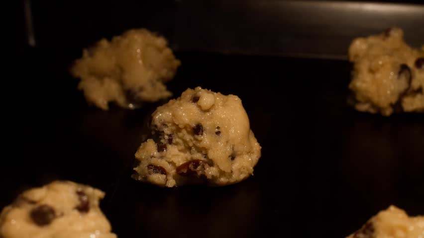 Homemade chocolate chip and raisin cookies - time lapse HD video