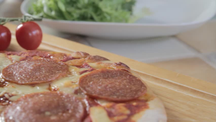 Pepperoni Pizza with tomatoes and lettuce