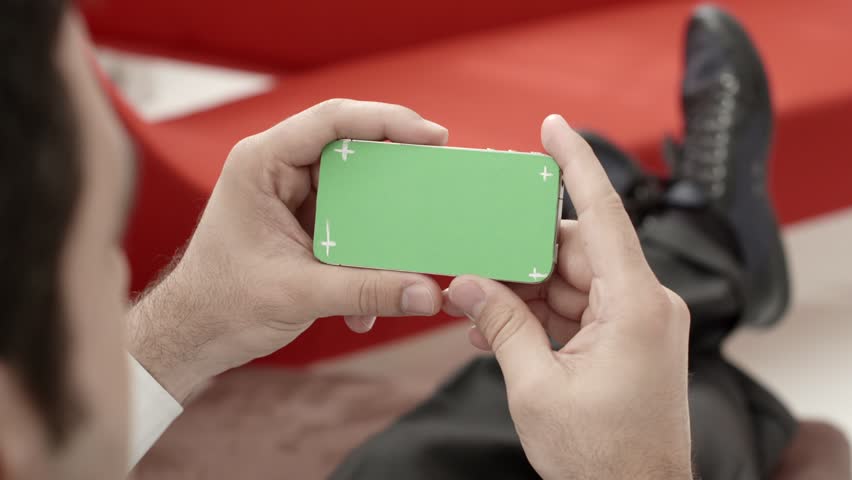 Technology and business, man using smart phone with green screen for internet and email. Sequence