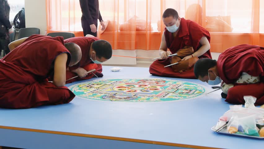 NOVOSIBIRSK - CIRCA APRIL 2012: Tibetan monks making sand mandala circa April 2012 in Novosibirsk, Russia.