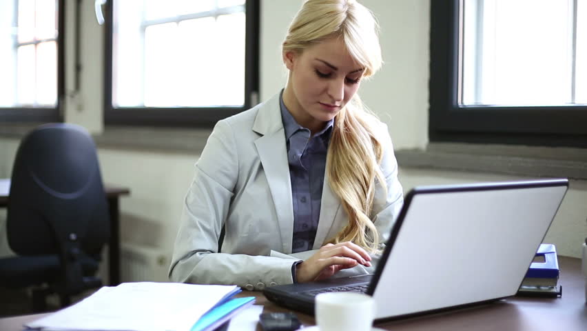 Businesswoman talking on cellphone during work