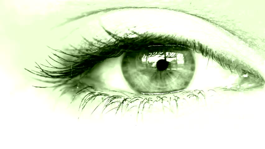 women's eye close up looking around green tinted