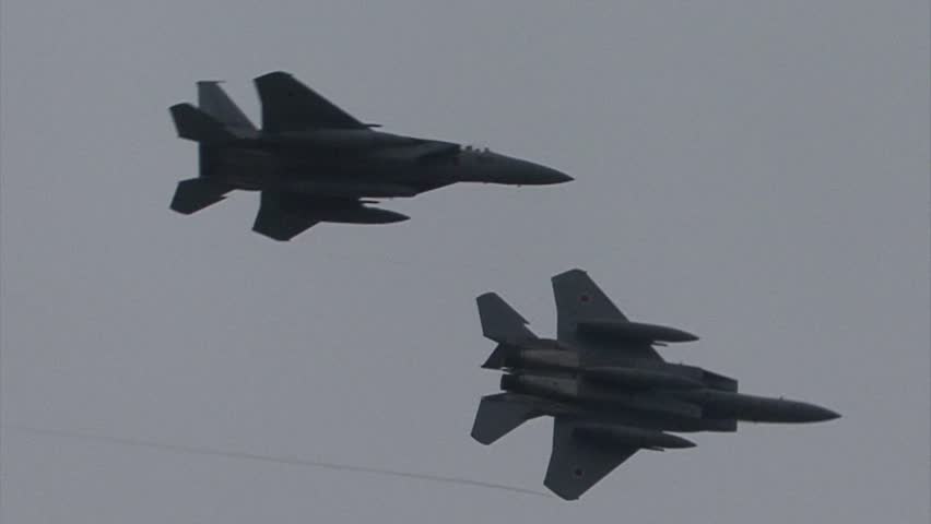 SHIZUOKA, JAPAN - MAY 20:  F-15 Eagle Afterburner pass and turn as part of the Japan Air Self Defense Force base airshow on May 20, 2012 in Shizuoka, Japan.