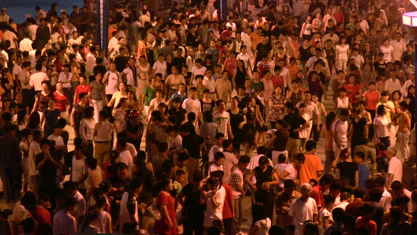 HARBIN - JULY 23 2008: People are dancing at night in the border town of Manzhouli, China