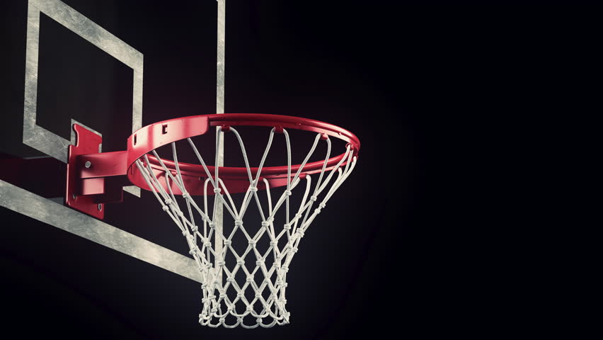 Close Up Of A Basketball Falling Through The Net Of The Hoop For A