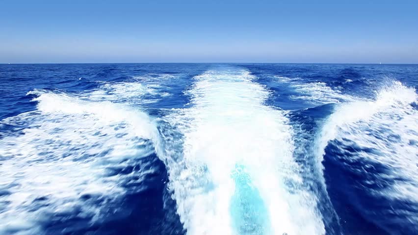 blue ocean sea with fast yacht boat wake foam of prop wash