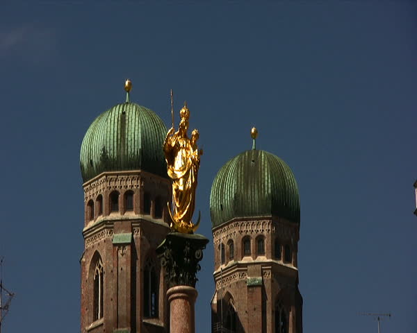 Statue of St Mary with the two towers of Frauenkirche, Church of Our Lady in Marienplatz Munich Bavaria Germany