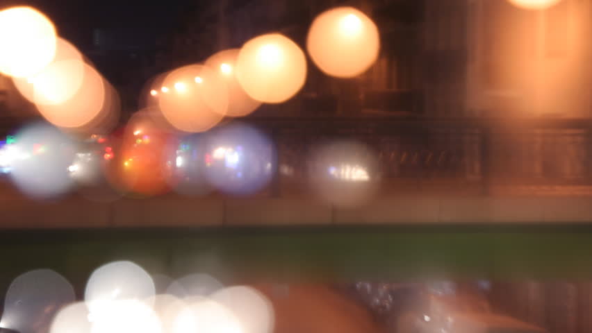 blurred timelapse at night of a road and bridge in marseille, france