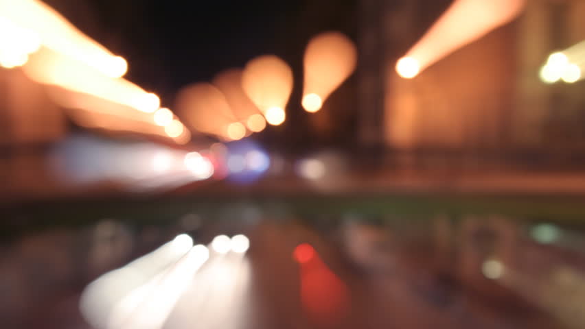 blurred timelapse at night of a road and bridge in marseille, france