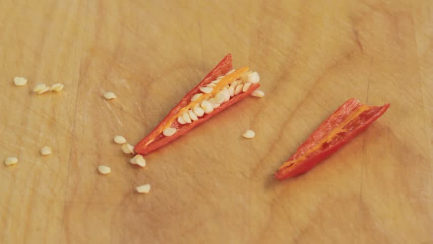 A chilli pepper being deseeded