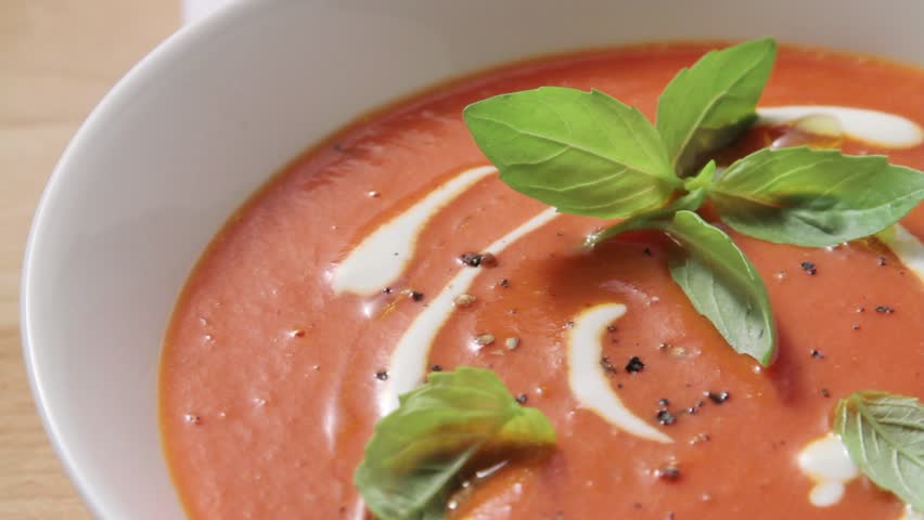 Cream of tomato soup with creme fraiche and fresh basil