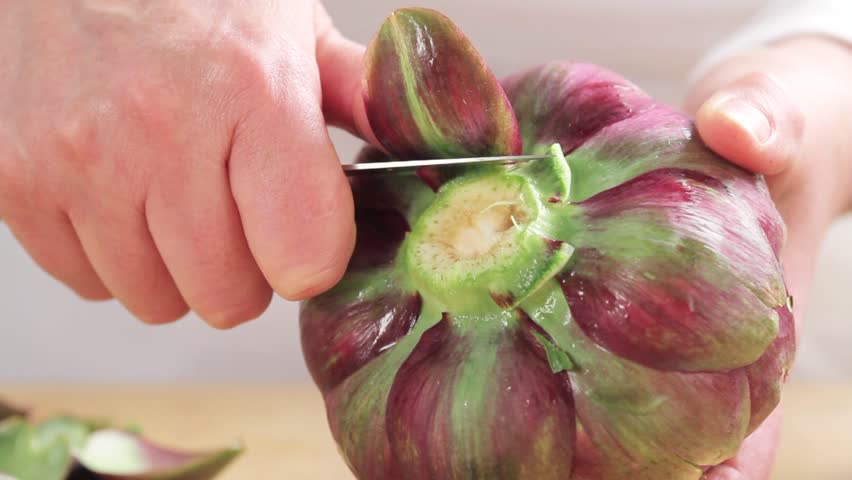 Removing lower leaves from artichokes