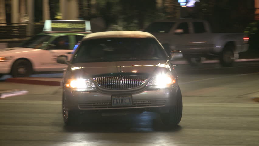 LAS VEGAS - MARCH 1: Stretch-Limo passing by on the Las Vegas strip at nighttime on March 1, 2012 in Las Vegas, USA. The Las Vegas Strip is approximately 4.2 mi (6.8 km) long.