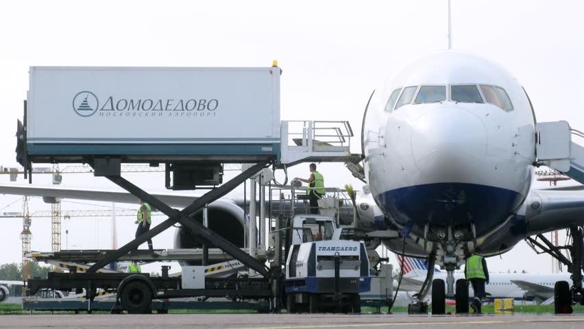 MOSCOW - MAY 22: (Timelapse View) Workers unload cargo from plane, on Domodedovo airport, on May 22, 2012 in Moscow, Russia