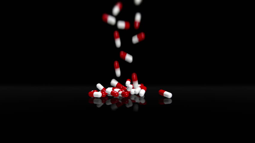 3D animation of red and white pills falling into scene. Black background version.