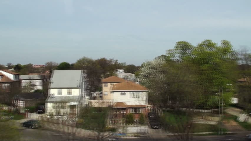View of the American town from the train window (in motion).