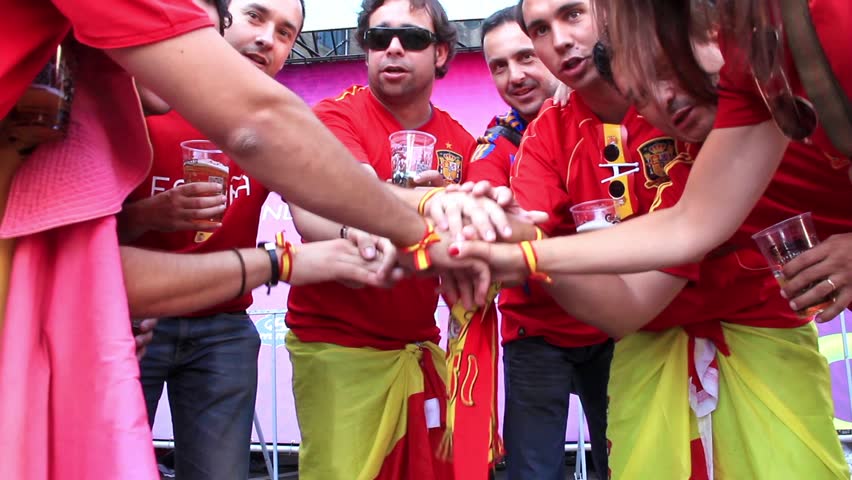 KIEV, UKRAINE - 1 JULY 2012: Spanish football fans in red shirts before final match of European Football Championship "EURO 2012" (Spain vs Italy), Kiev, Ukraine, July 1, 2012.