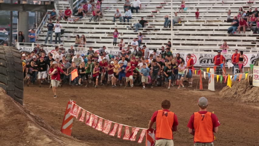 NEPHI, JUAB, UTAH 30 JUN 2012: Annual cross country obstacle course fun run competition. Dozens of participants run around course designed for a extreme enduro motocross race. Fun, exercise activity.