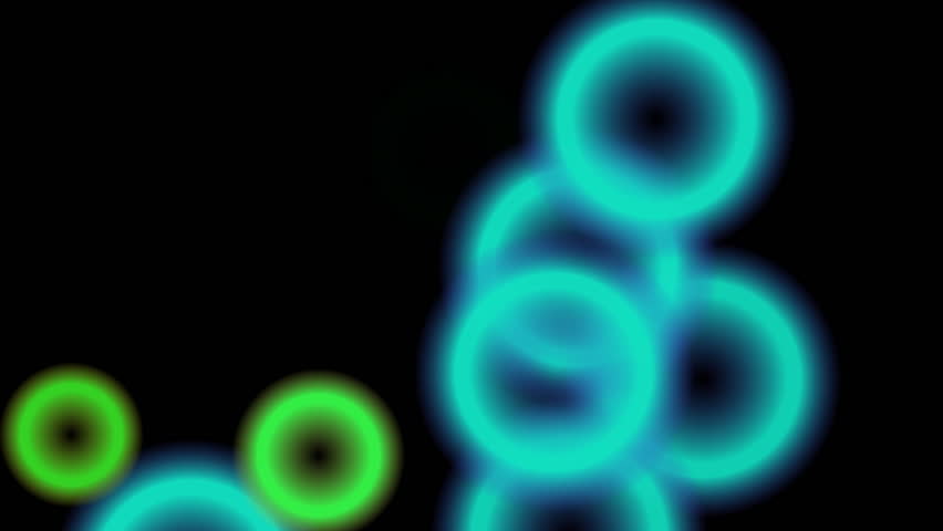 Circles of light flash on the screen as if dancing to the beat of a song. (High Definition 1080p)