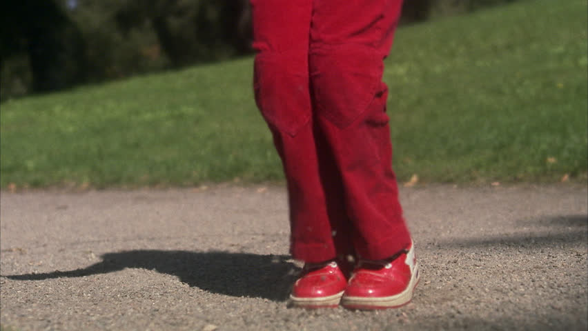 The legs of a skipping girl