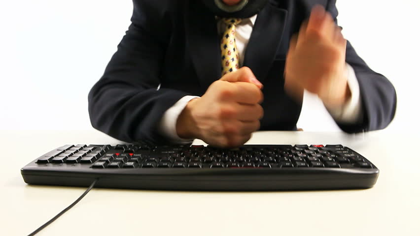 office hacker breaking keyboard